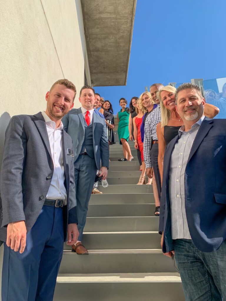 group of leaders from leadership west standing on stairs